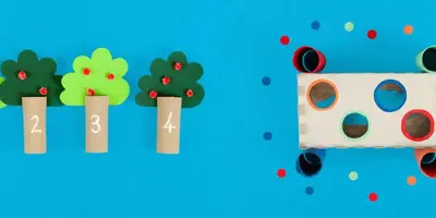 Jogos para o desenvolvimento de habilidades motoras finas feitos de tubos de papel higiénico vazios e decorados e uma caixa de lenços de papel